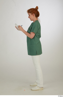  Photos Daya Jones Nurse in green Pose 2 preparing medication standing whole body 0003.jpg